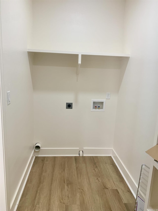 12409 Styles Rd, Bauxite, AR 72011 - washroom featuring hookup for a washing machine, wood finished floors, hookup for an electric dryer, and baseboards
