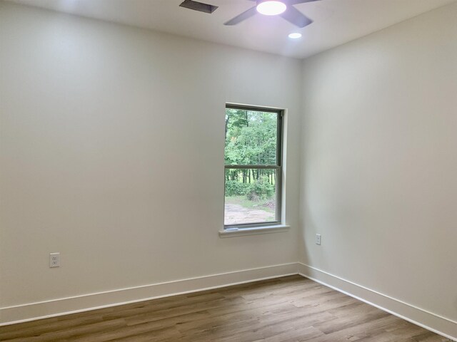 12409 Styles Rd, Bauxite, AR 72011 - empty room with a ceiling fan, wood finished floors, baseboards, and recessed lighting