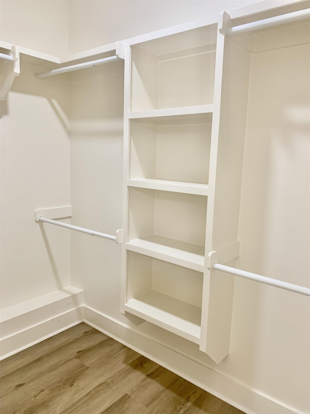 12409 Styles Rd, Bauxite, AR 72011 - walk in closet featuring wood finished floors