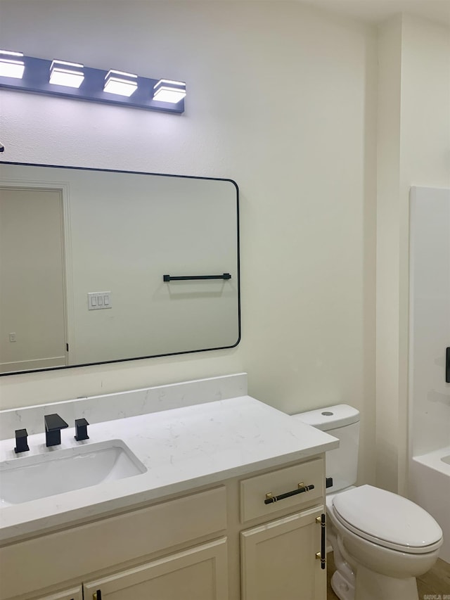 12409 Styles Rd, Bauxite, AR 72011 - bathroom with vanity, toilet, and a bathtub