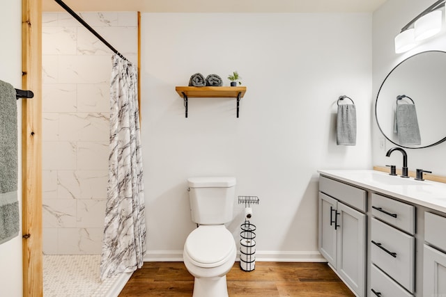3316 Carmine Cv, Bryant, AR 72202 - bathroom with vanity, toilet, wood finished floors, tiled shower, and baseboards