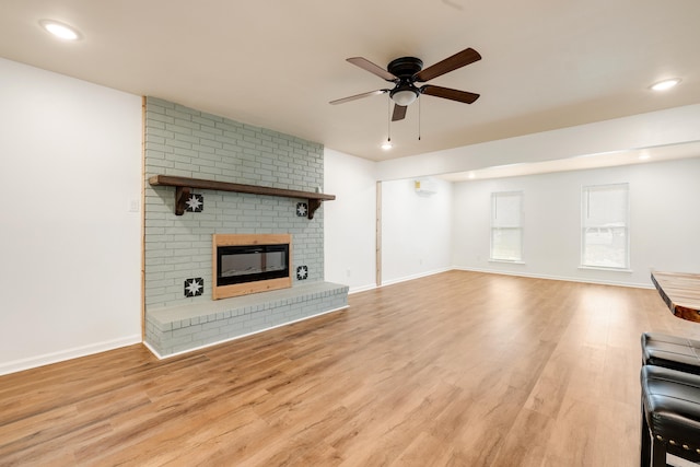 3316 Carmine Cv, Bryant, AR 72202 - unfurnished living room with ceiling fan, light wood-style flooring, recessed lighting, baseboards, and a fireplace
