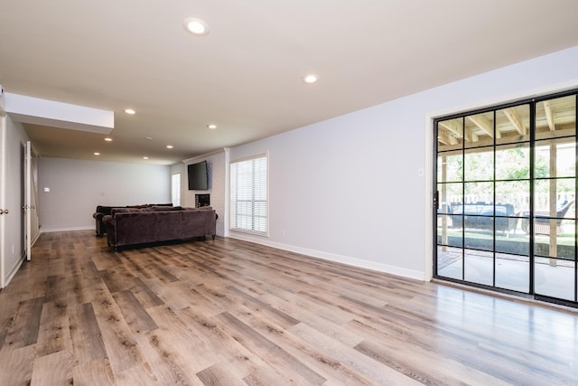 122 Glen Dr, Little Rock, AR 72207 - unfurnished living room with baseboards, light wood finished floors, and recessed lighting