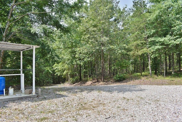 312 Broken Bow Trl, Lonsdale, AR 72087 - view of yard with a forest view