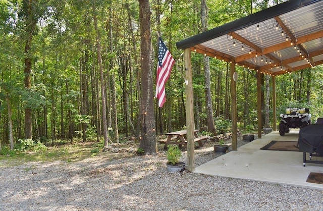 312 Broken Bow Trl, Lonsdale, AR 72087 - view of yard featuring a patio and a wooded view