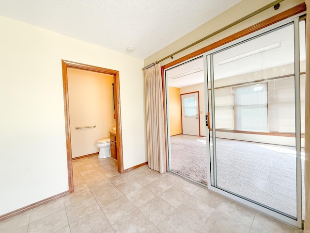 1908 Honeysuckle Dr, Mountain Home, AR 72653 - spare room featuring light tile patterned flooring and baseboards