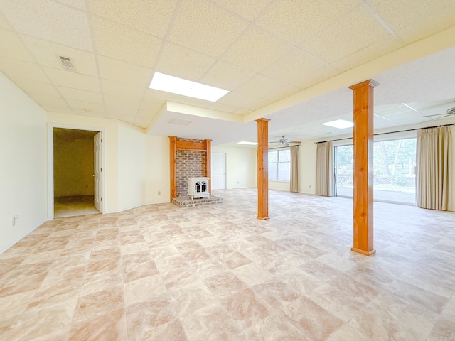 1908 Honeysuckle Dr, Mountain Home, AR 72653 - basement with a wood stove and a drop ceiling