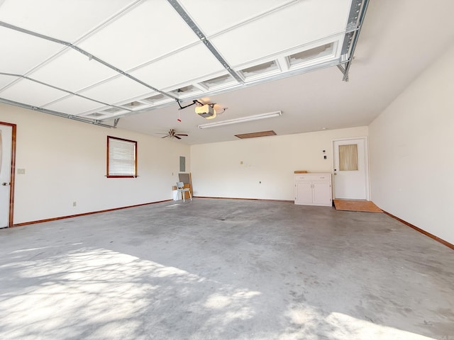 1908 Honeysuckle Dr, Mountain Home, AR 72653 - garage with a garage door opener, baseboards, and electric panel