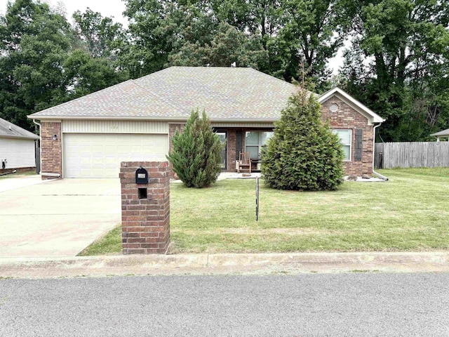 135 Meadow Dr, Beebe, AR 72012 - ranch-style home with concrete driveway, brick siding, a garage, and view of wooded area