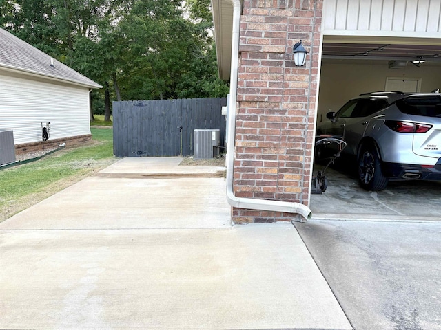 135 Meadow Dr, Beebe, AR 72012 - garage with concrete driveway and central air condition unit