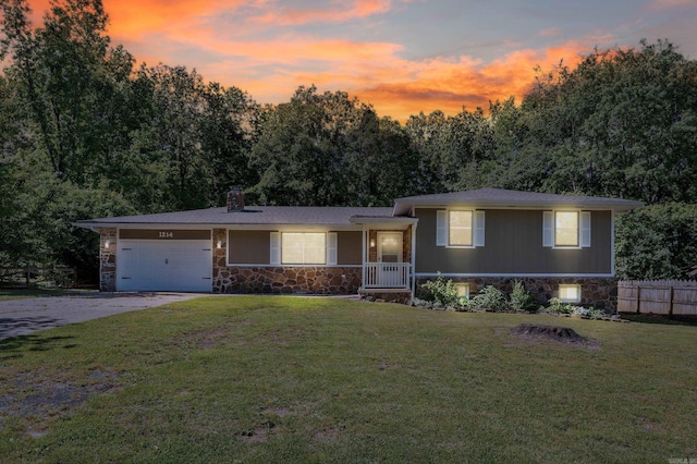 1214 Sammy St, Mountain Home, AR 72653 - split level home featuring stone siding, driveway, an attached garage, and a chimney