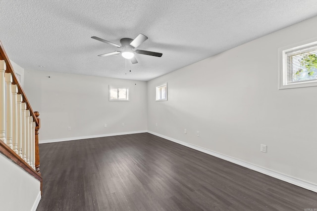 1214 Sammy St, Mountain Home, AR 72653 - empty room featuring dark wood-style floors, ceiling fan, stairway, a textured ceiling, and baseboards