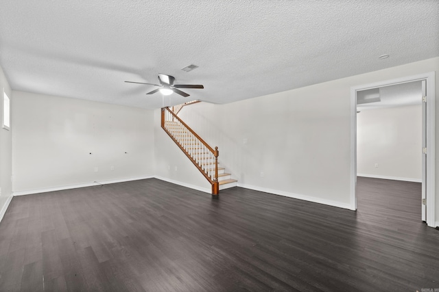 1214 Sammy St, Mountain Home, AR 72653 - unfurnished living room with stairway, a ceiling fan, dark wood-style flooring, baseboards, and a textured ceiling