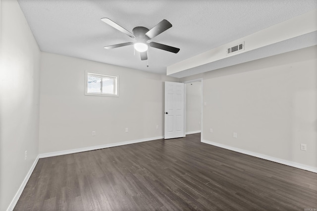 1214 Sammy St, Mountain Home, AR 72653 - empty room featuring dark wood-type flooring, ceiling fan, baseboards, and a textured ceiling