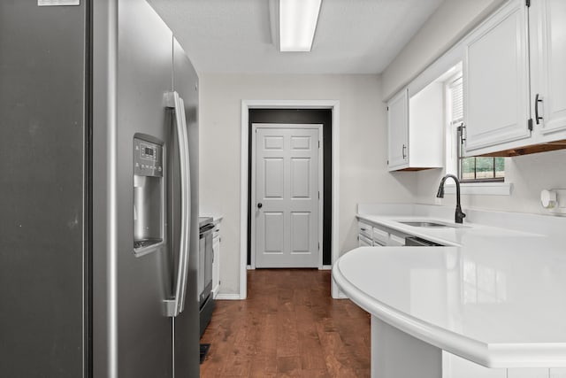 1214 Sammy St, Mountain Home, AR 72653 - kitchen featuring stainless steel refrigerator with ice dispenser, a sink, white cabinets, dark wood finished floors, and light countertops