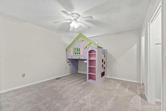 1214 Sammy St, Mountain Home, AR 72653 - unfurnished bedroom with carpet flooring, a textured ceiling, ceiling fan, and baseboards