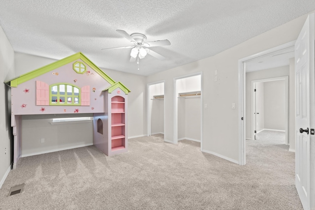 1214 Sammy St, Mountain Home, AR 72653 - unfurnished bedroom with carpet, a textured ceiling, baseboards, and a ceiling fan