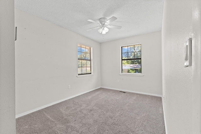 1214 Sammy St, Mountain Home, AR 72653 - unfurnished room with carpet floors, a textured ceiling, ceiling fan, and baseboards