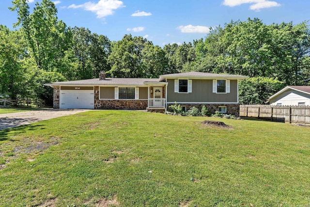 1214 Sammy St, Mountain Home, AR 72653 - tri-level home featuring stone siding, driveway, a chimney, and a garage