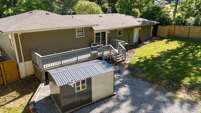 1214 Sammy St, Mountain Home, AR 72653 - rear view of property with a deck, a chimney, an outdoor structure, and roof with shingles
