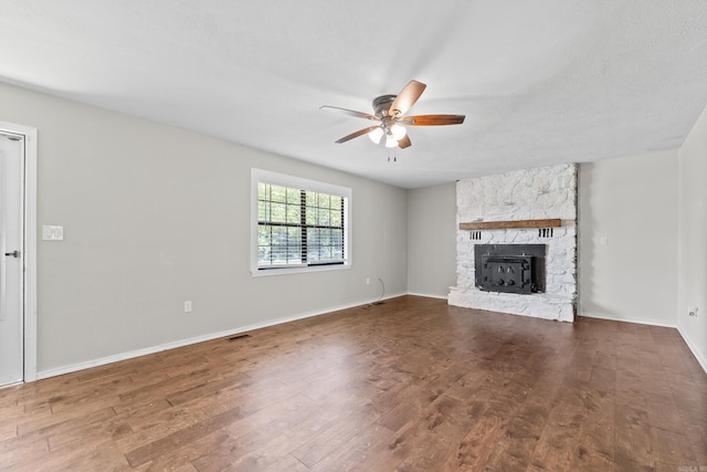 1214 Sammy St, Mountain Home, AR 72653 - unfurnished living room featuring ceiling fan, wood finished floors, a fireplace, and baseboards