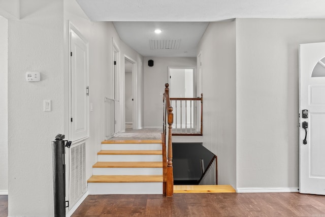 1214 Sammy St, Mountain Home, AR 72653 - stairway with wood finished floors and baseboards