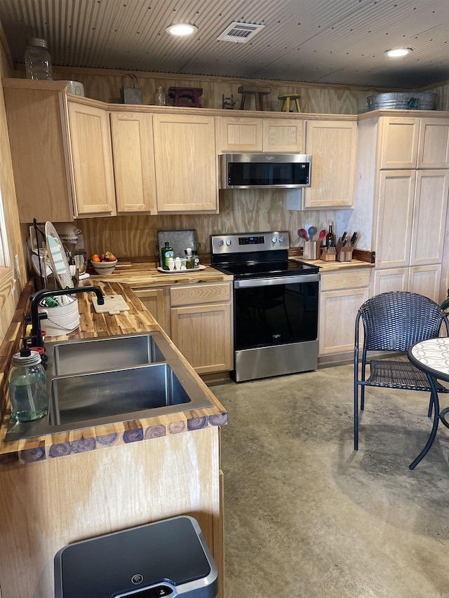 630 Cliffview Dr, Quitman, AR 72131 - kitchen featuring stainless steel appliances, light brown cabinetry, a sink, and finished concrete flooring