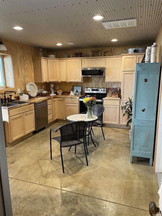630 Cliffview Dr, Quitman, AR 72131 - kitchen with appliances with stainless steel finishes, exhaust hood, a sink, concrete floors, and light brown cabinets