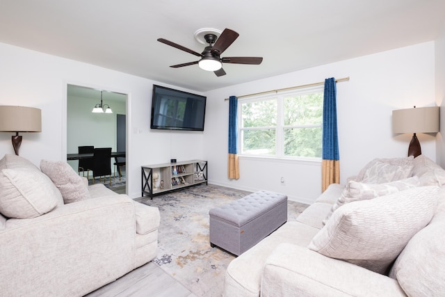 4605 N Cedar, North Little Rock, AR 72116 - living area featuring a ceiling fan, wood finished floors, and baseboards