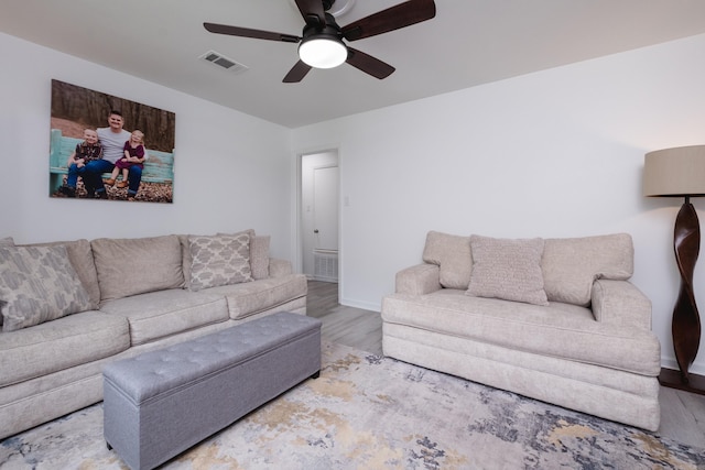 4605 N Cedar, North Little Rock, AR 72116 - living room with wood finished floors, a ceiling fan, and baseboards