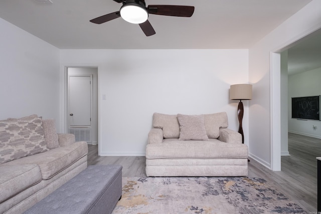 4605 N Cedar, North Little Rock, AR 72116 - living area featuring wood finished floors, baseboards, and a ceiling fan