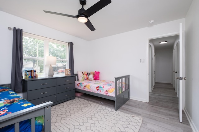 4605 N Cedar, North Little Rock, AR 72116 - bedroom featuring light wood-type flooring, baseboards, and ceiling fan