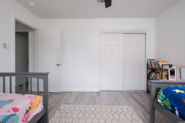 4605 N Cedar, North Little Rock, AR 72116 - bedroom with wood finished floors, a closet, and baseboards