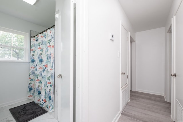 4605 N Cedar, North Little Rock, AR 72116 - bathroom with curtained shower and baseboards