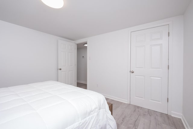 4605 N Cedar, North Little Rock, AR 72116 - bedroom featuring light wood-style floors and baseboards