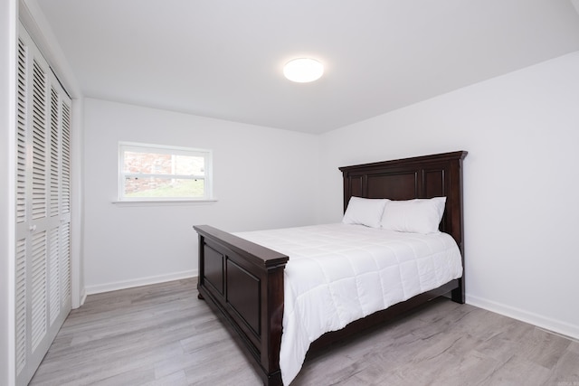 4605 N Cedar, North Little Rock, AR 72116 - bedroom with light wood-style floors, a closet, and baseboards