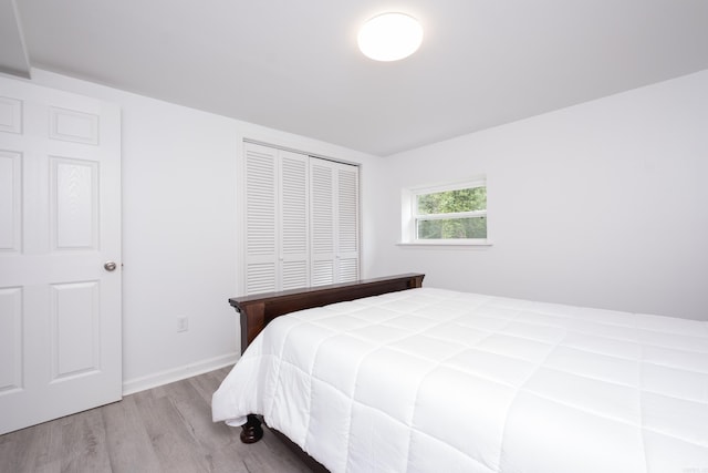 4605 N Cedar, North Little Rock, AR 72116 - bedroom featuring wood finished floors, a closet, and baseboards