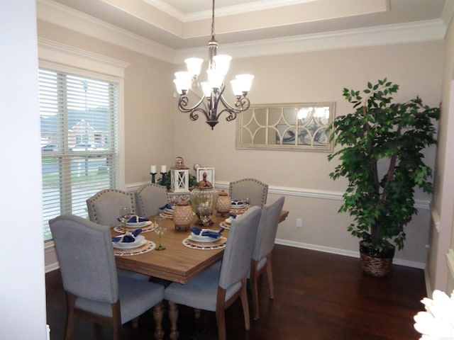 21 Sanibel Cv, Little Rock, AR 72210 - dining space featuring dark wood-style flooring, a chandelier, a tray ceiling, ornamental molding, and baseboards