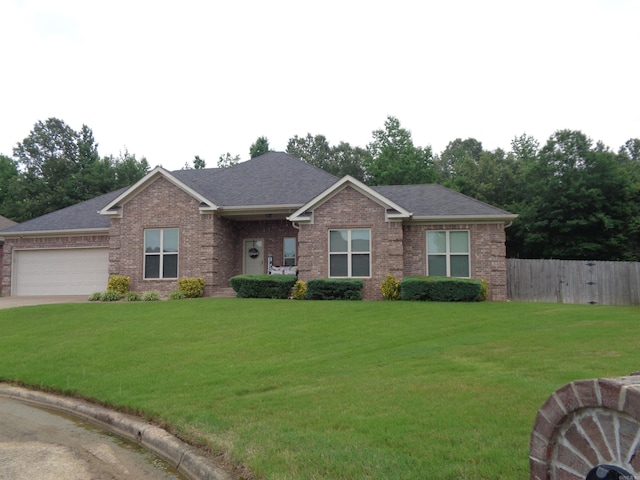 21 Sanibel Cv, Little Rock, AR 72210 - view of front of home featuring brick siding, a garage, driveway, and a shingled roof