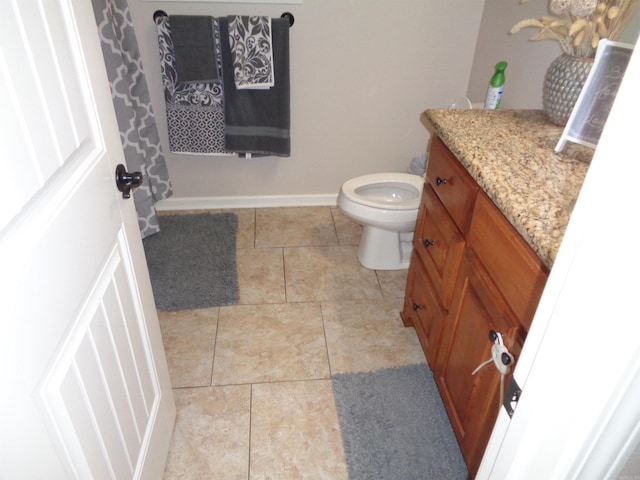 21 Sanibel Cv, Little Rock, AR 72210 - bathroom with vanity, toilet, tile patterned flooring, and baseboards