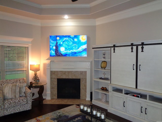 21 Sanibel Cv, Little Rock, AR 72210 - living room with ornamental molding, a tile fireplace, and wood finished floors