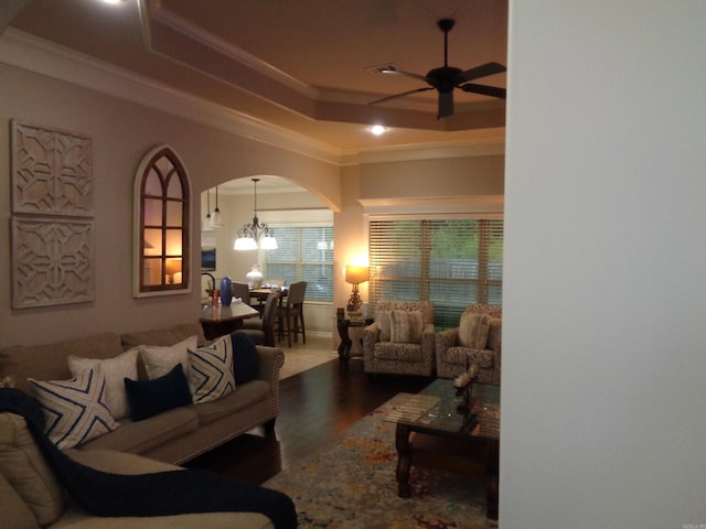 21 Sanibel Cv, Little Rock, AR 72210 - living room with crown molding, a raised ceiling, a ceiling fan, wood finished floors, and arched walkways