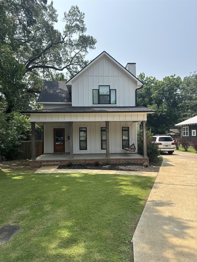 1927 College Ave, Conway, AR 72034 - view of front of home with board and batten siding, a porch, a chimney, a shingled roof, and concrete driveway