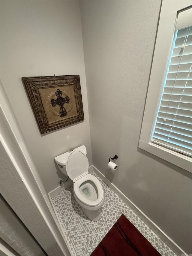 1927 College Ave, Conway, AR 72034 - bathroom featuring toilet and baseboards