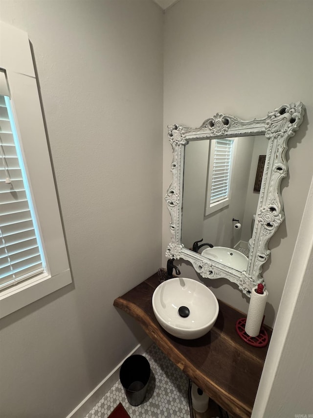1927 College Ave, Conway, AR 72034 - half bath featuring a sink and tile patterned floors