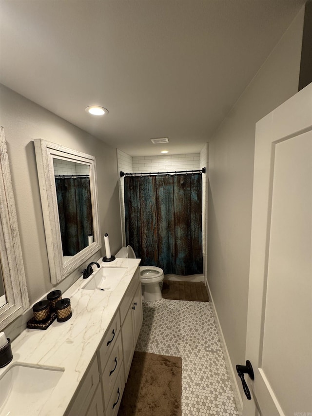 1927 College Ave, Conway, AR 72034 - full bathroom with double vanity, curtained shower, toilet, and recessed lighting