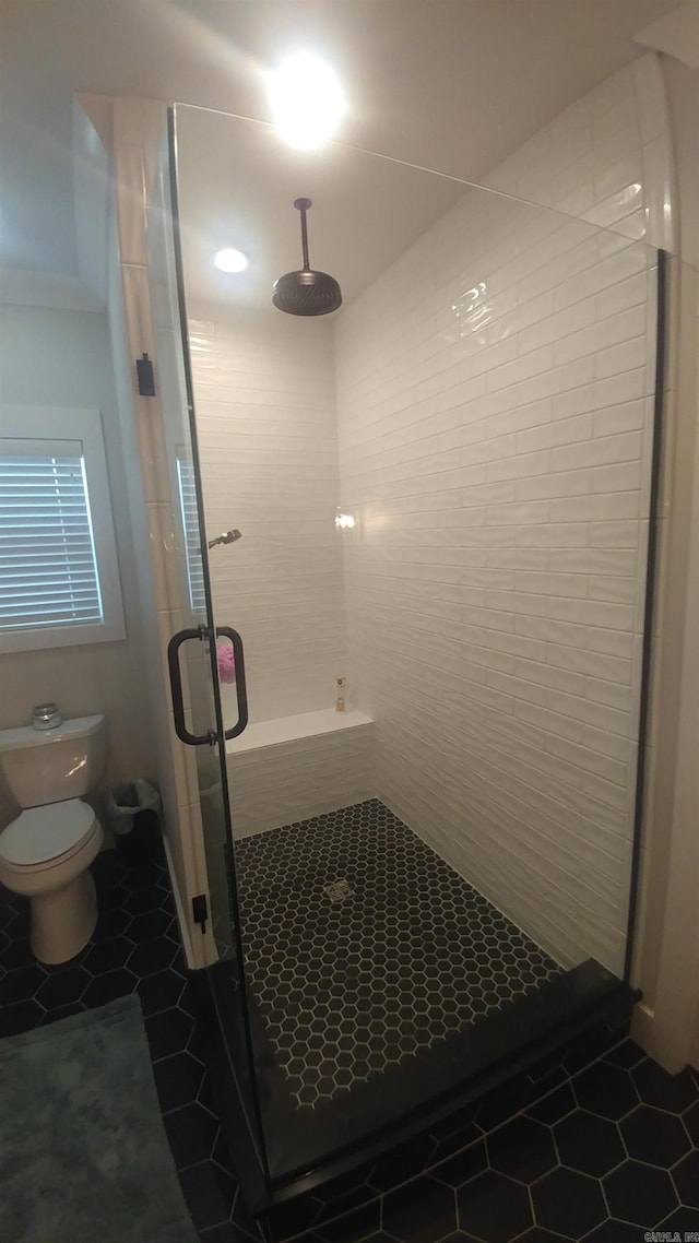 1927 College Ave, Conway, AR 72034 - full bath with tile patterned floors, a stall shower, and toilet