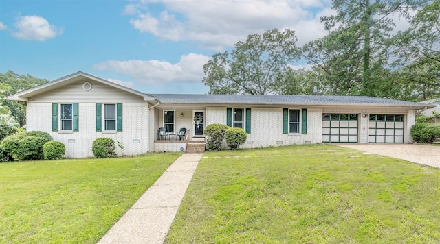 4204 Fox Hill Rd, North Little Rock, AR 72116 - single story home with covered porch, crawl space, brick siding, a garage, and a front yard