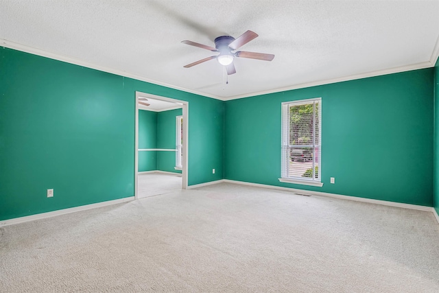 4204 Fox Hill Rd, North Little Rock, AR 72116 - carpeted spare room with ornamental molding, ceiling fan, a textured ceiling, and baseboards