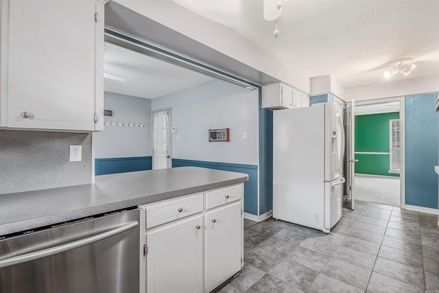 4204 Fox Hill Rd, North Little Rock, AR 72116 - kitchen with white refrigerator with ice dispenser, dishwasher, white cabinetry, a peninsula, and a textured ceiling